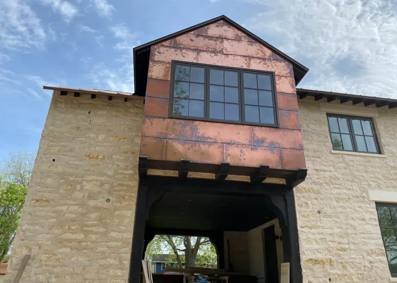 Copper metal panel facade on a stone building for Metal Roof Coating in Wheat Ridge