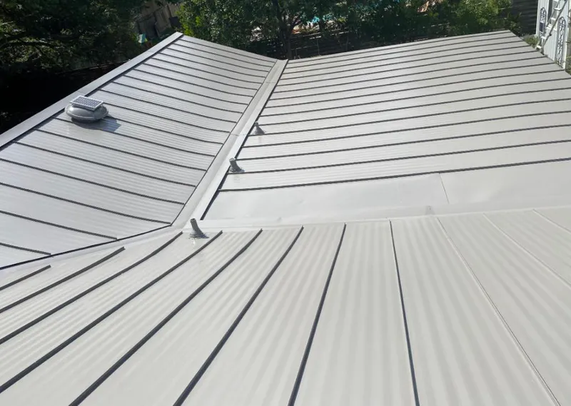 Solar attic fan installed on a metal roof for Roof Ventilation in Wheat Ridge